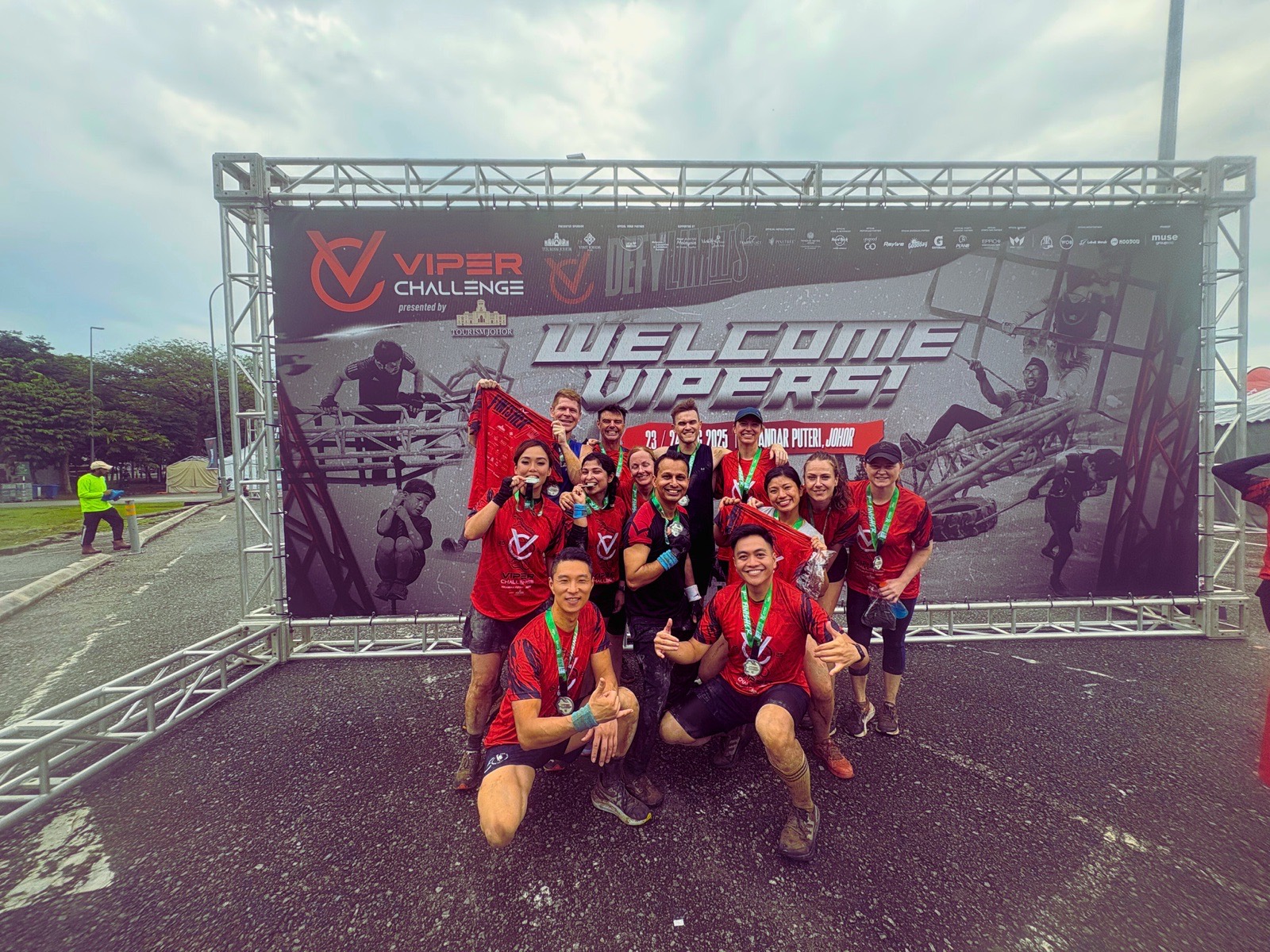A FitBeat team with their medals at the Viper Challenge finish arch