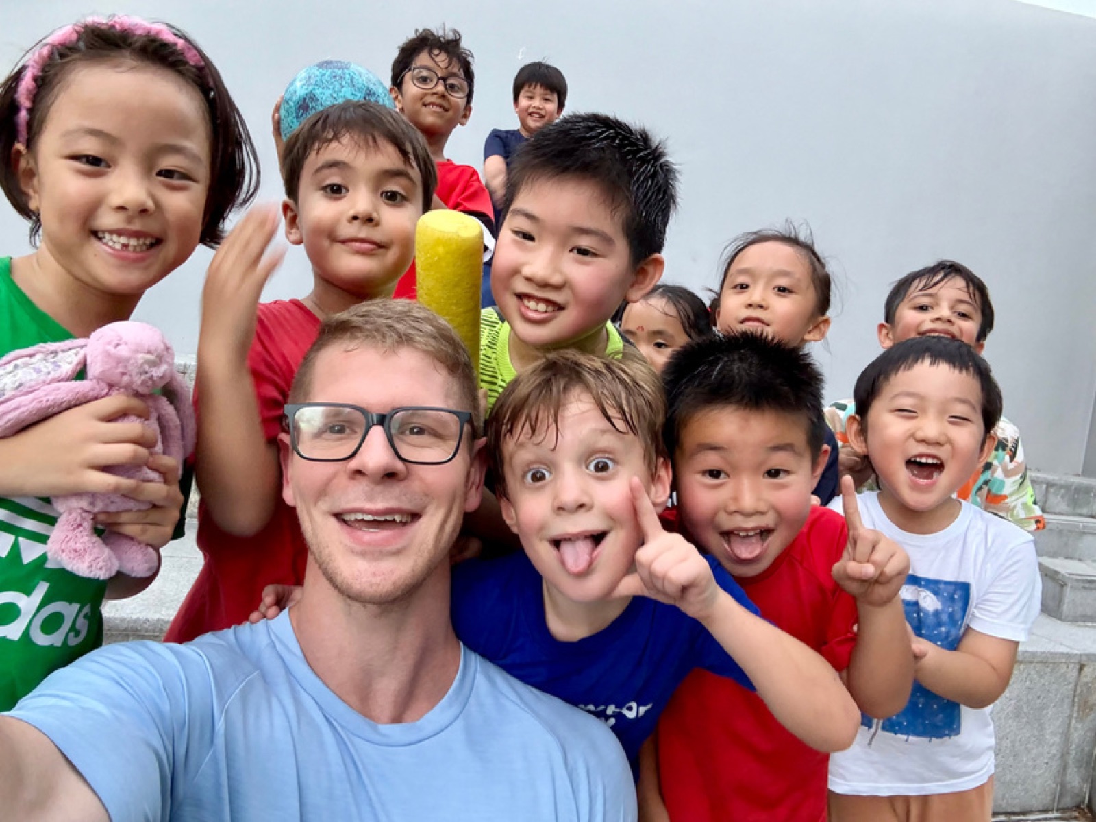 A FitBeat coach and a group of kids after a session in Singapore