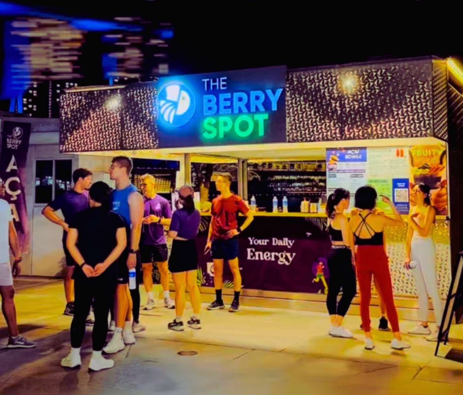 FitBeat runners gathered at The Berry Spot kiosk after an evening run