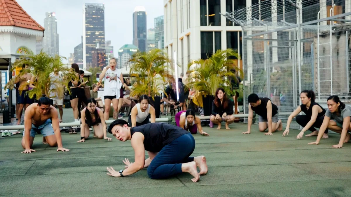 Varun Kapoor leads an Animal Flow class on a Singapore rooftop.